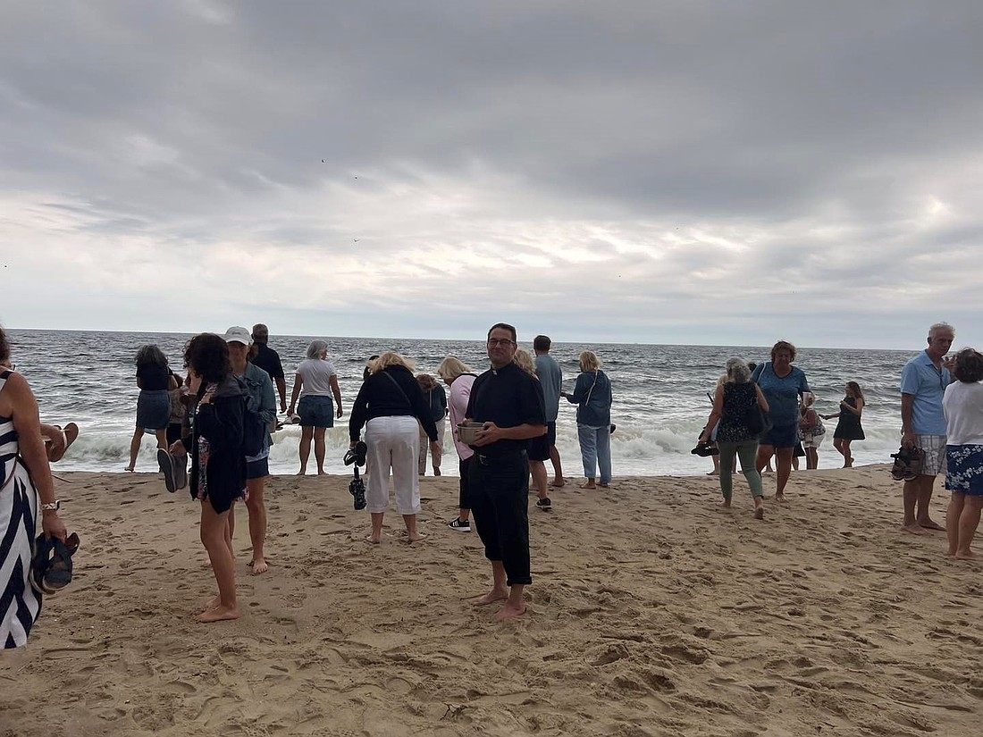 Each year on the Feast of Our Lady of the Assumption, Aug. 15, Father Lago and parishioners gather at the beachfront in Manasquan for the blessing of the ocean. The parishioners are then invited to wade into the ocean and collect their own jugs of newly blessed water.