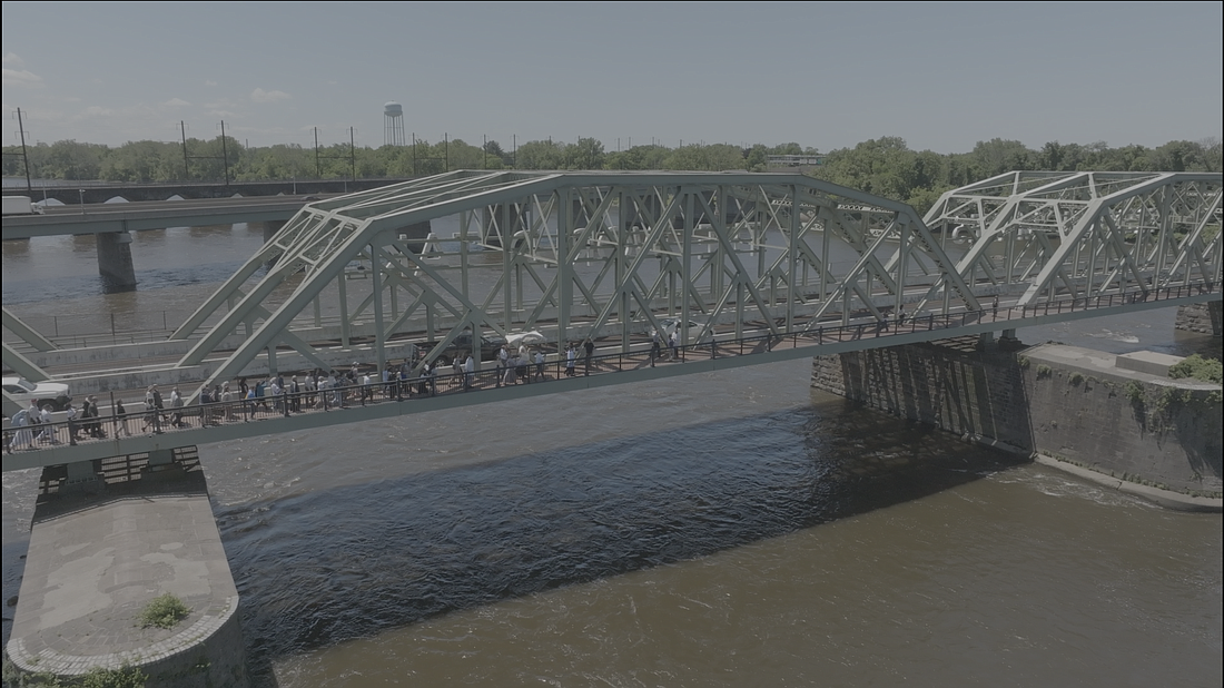 Drone footage provides a bird’s eye view of the Eucharist Procession crossing the Lower Trenton Bridge into Pennsylvania May 31. “Walking with Jeus” video screenshots