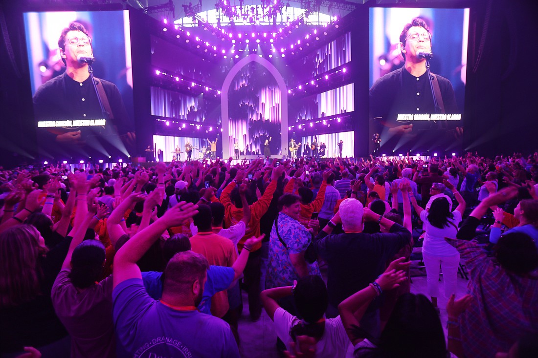 Pilgrims cheer as a Dave and Lauren Moore and others perform  July 19, 2024, during the third revival night of the National Eucharistic Congress at Lucas Oil Stadium in Indianapolis. OSV News photo/Bob Roller.