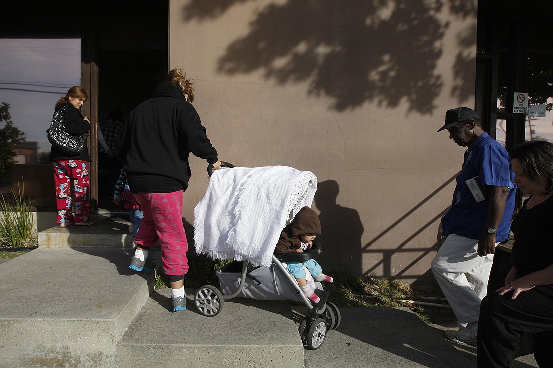 A family is pictured in a file photo entering a food bank in in Monrovia, Calif. The U.S. Senate failed to advance a major tax package Aug. 1, 2024, that would have bolstered the popular child tax credit as a pro-family and anti-poverty effort, while cutting taxes for businesses. The bipartisan bill had cleared the House in January by wide margins. (OSV News photo/David McNew, Reuters)