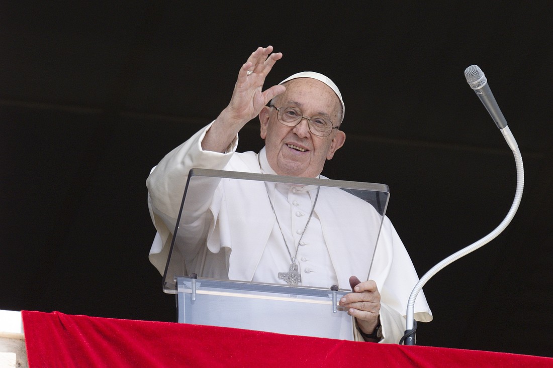 Pope Francis waves to visitors and pilgrims gathered in St. Peter's Square at the Vatican for the recitation of the Angelus prayer Aug. 4, 2024. (CNS photo/Vatican Media)..