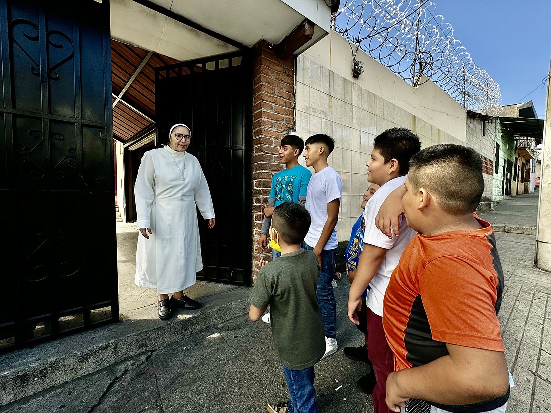 Sister Silvia Flores chats with new students Jan. 25, 2024, at the Colegio Eucarístico run by her congregation, the Mercedarian Sisters of the Blessed Sacrament in San Salvador. Through the Vatican-funded Sowing Seeds of Hope initiative, Catholic schools run by congregations of women religious in El Salvador welcome at-risk children. (OSV News photo/Rhina Guidos, Global Sisters Report)