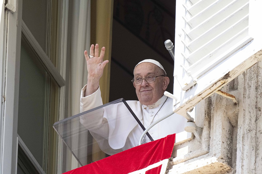 Pope Francis waves to visitors gathered in St. Peter's Square at the Vatican to pray the Angelus Aug. 11, 2024. (CNS photo/Vatican Media)