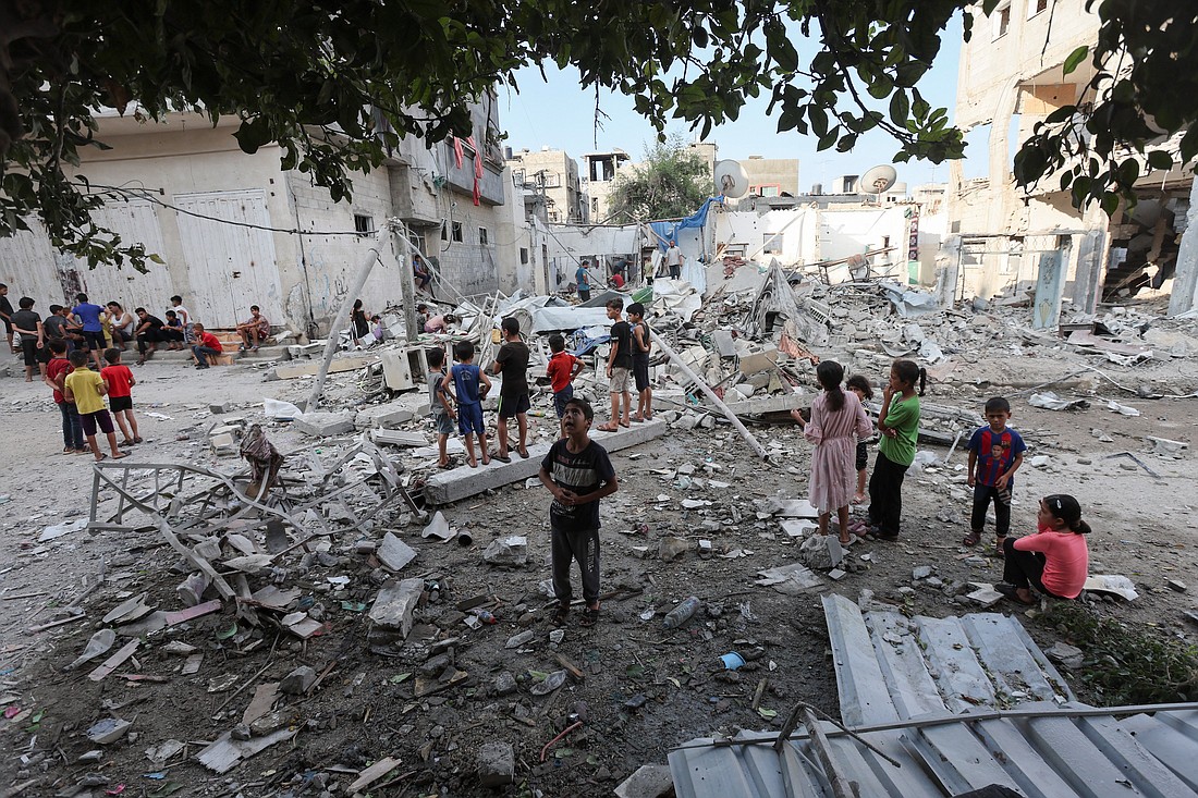 Palestinian children stand at the site of an Israeli airstrike on a house in the Maghazi refugee camp in the central Gaza Strip Aug. 14, 2024. (OSV News photo/Ramadan Abed, Reuters).