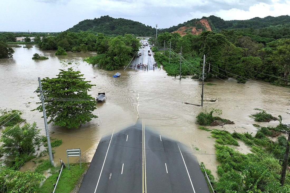 A drone view shows a bridge submerged by the flooded La Plata River in Toa Baja, Puerto Rico, in the aftermath of Hurricane Ernesto  Aug.14, 2024. Archbishop Roberto O. Gonzalez Nieves of San Juan suspended Masses and pastoral activities Aug. 13 and 14 as Ernesto battered Puerto Rico, leaving hundreds of thousands without power. (OSV News photo/Ricardo Arduengo, Reuters)