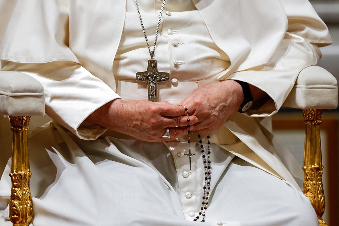 Pope Francis holds his rosary as he prays for peace in St. Peter's Basilica with members of the assembly of the Synod of Bishops at the Vatican Oct. 27, 2023. (CNS photo/Lola Gomez)