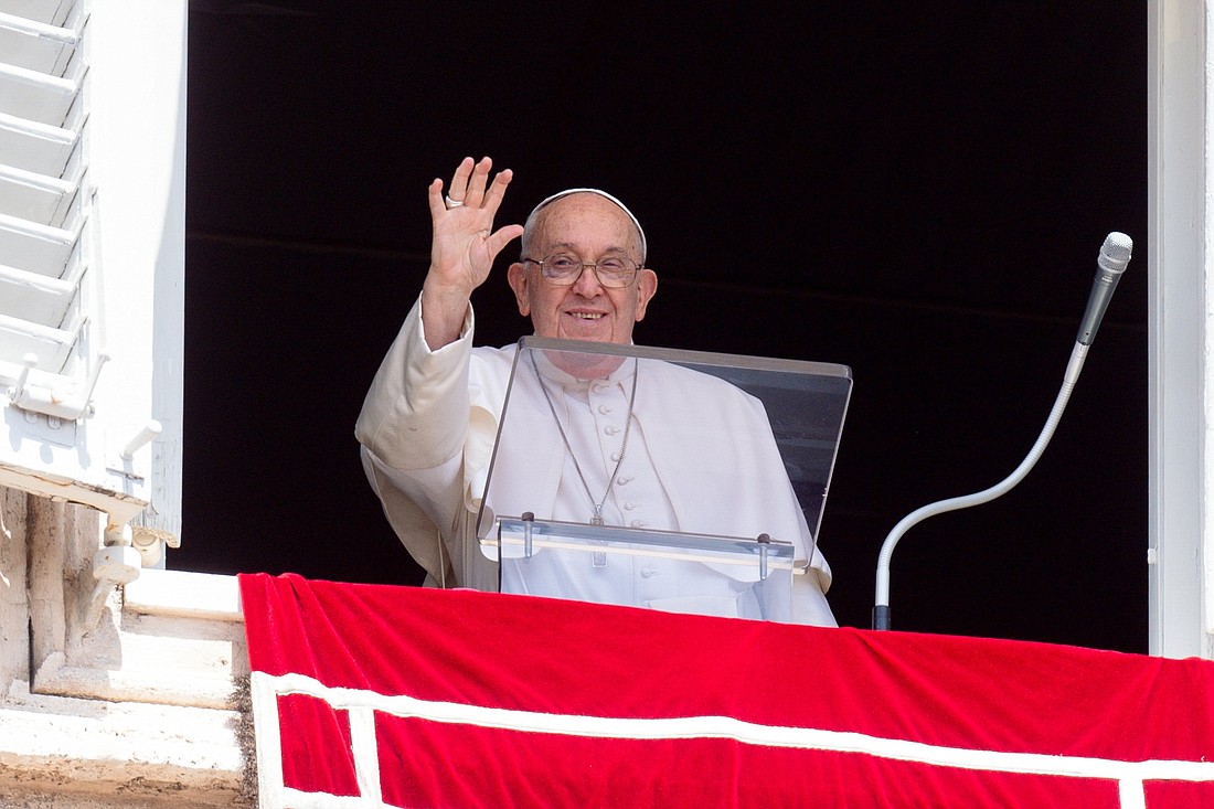 Pope Francis greets visitors gathered in St. Peter's Square at the Vatican to pray the Angelus Aug. 18, 2024. (CNS photo/Vatican Media)