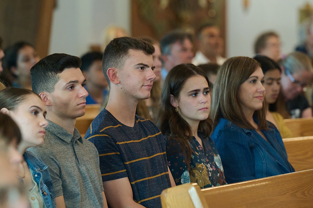 Congregants listen attentively during a March 29 Mass in St. Mary of the Pines Church, Manahawkin, one of the host sites of the diocesan Eucharistic Pilgrimage in late May. Mike Ehrmann photo