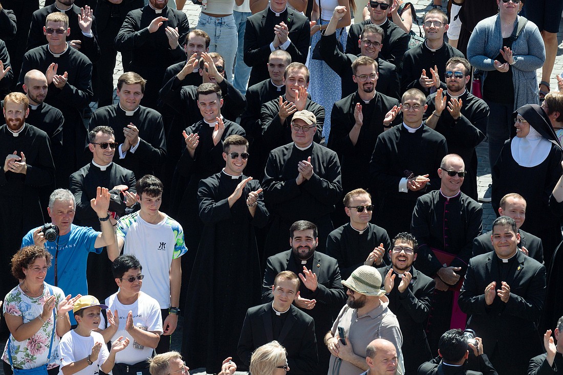 New seminarians and staff members of the Pontifical North American College, the U.S. seminary in Rome, greet Pope Francis after praying the Angelus in St. Peter's Square at the Vatican Aug. 25, 2024. (CNS photo/Vatican Media)