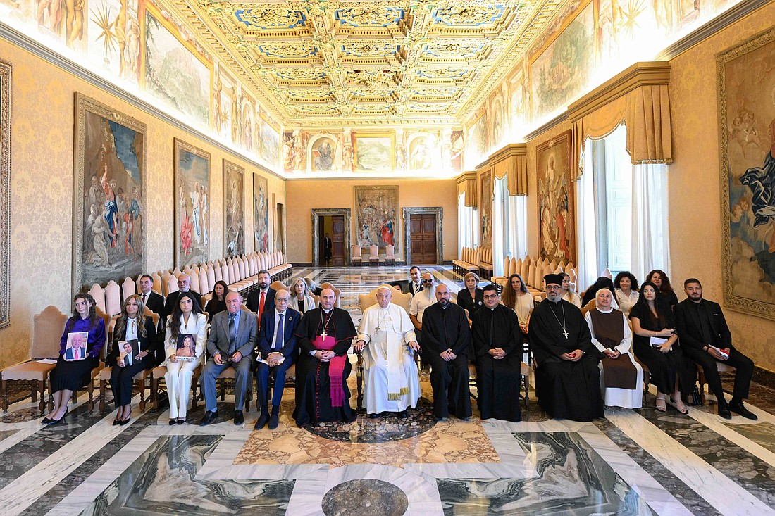 Pope Francis poses for a photo with family members of victims of the 2020 Beirut port explosion during a meeting at the Vatican, Aug. 26. 2024. (CNS photo/Vatican Media)