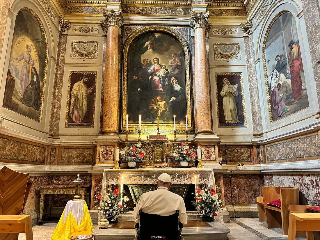 Pope Francis stops to pray before the tomb of St. Monica in the Rome basilica named for her son, St. Augustine, on the feast of St. Monica, Aug. 17, 2024. (CNS photo/Vatican press office) Editors: best quality available.