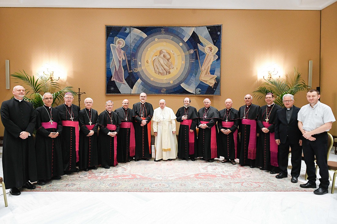 Pope Francis poses for a photo with members of the Conference of Latin Bishops of the Arab Regions, which includes bishops from Israel, Palestine, Jordan, Lebanon, Iraq, Syria, Djibouti, Egypt, Cyprus and the Persian Gulf at the Vatican Aug. 28, 2024. (CNS photo/Vatican Media)