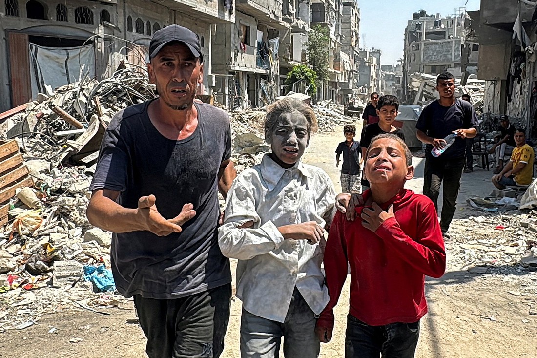 Palestinians react at the site of an Israeli airstrike that destroyed several houses, amid Israel-Hamas conflict, in Khan Younis in the southern Gaza Strip Aug. 27, 2024. (OSV News photo/Mohammed Salem, Reuters)