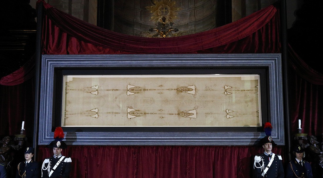 The Shroud of Turin is pictured in a file photo during a preview for journalists at the Cathedral of St. John the Baptist in Turin, Italy. A study published in July revealed that a new analysis of the shroud, including the composition and a microscopic analysis of the blood, shows that the marks are consistent with the tortures endured by Christ as described in the Gospels. (CNS photo/Paul Haring)