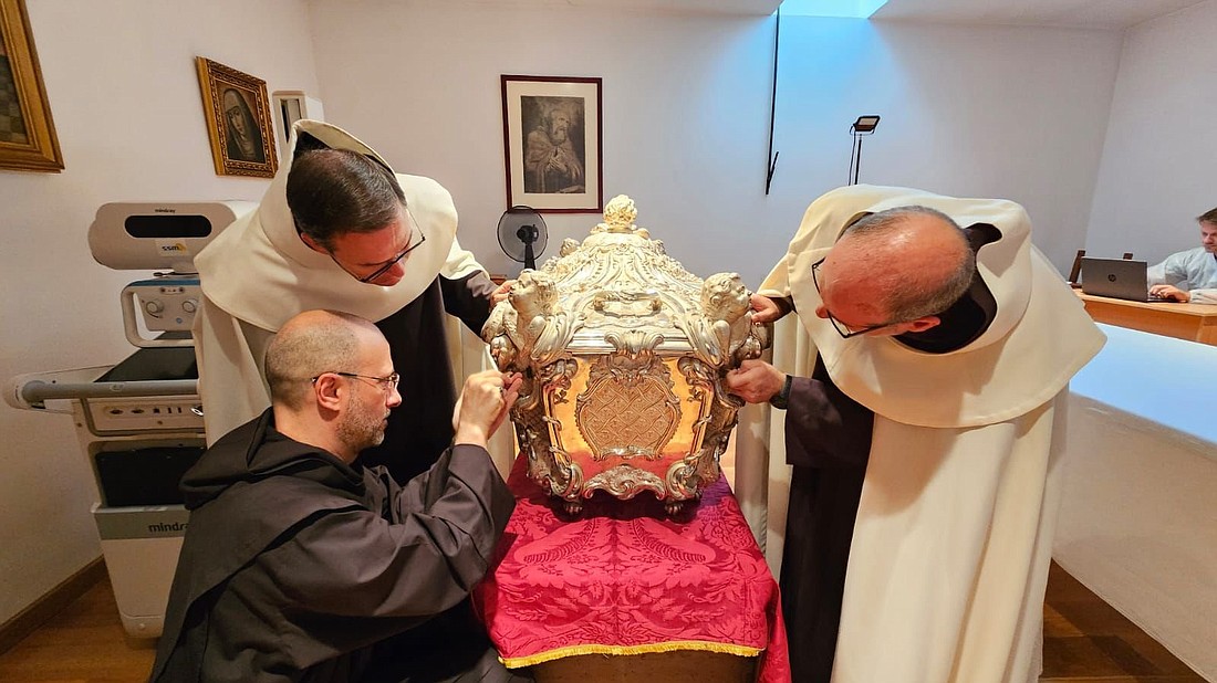 The silver coffin containing the body of St. Teresa of Avila in Alba de Tormes, Spain, is opened for the first time since 1914 and marked the beginning of a study of her relics, which will be carried out by Italian doctors and scientists with Vatican approval. (OSV News photo/courtesy Order of Carmel) Editors: best quality available..