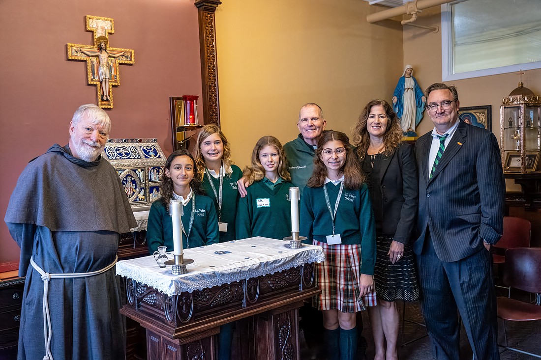 During the 100th anniversary celebration of St. Peter School, Point Pleasant Beach, Bishop O'Connell poses for a photo with Conventual Franciscan Father Robert Schlageter, pastor of St. Peter Parish; Tracey Kobrin, school principal; Dr. Vincent de Paul Schmidt, diocesan superintendent of Catholic schools, and students. Hal Brown photo