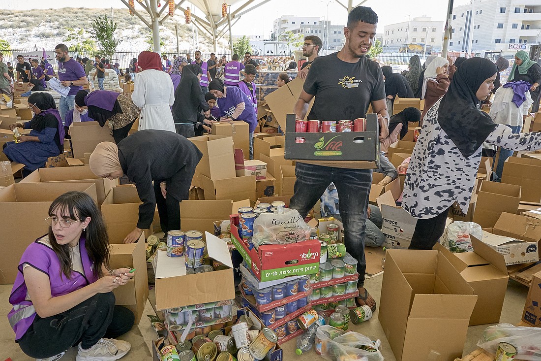 Residents of Rahat, Israel, pack food for people in Gaza on Aug. 18, 2024. The collection of food in Rahat, a largely Bedouin community, was organized by Standing Together, an Israeli grassroots movement that aims to bring together Arab-Israeli and Jewish-Israeli communities. (OSV News photo/Paul Jeffrey).