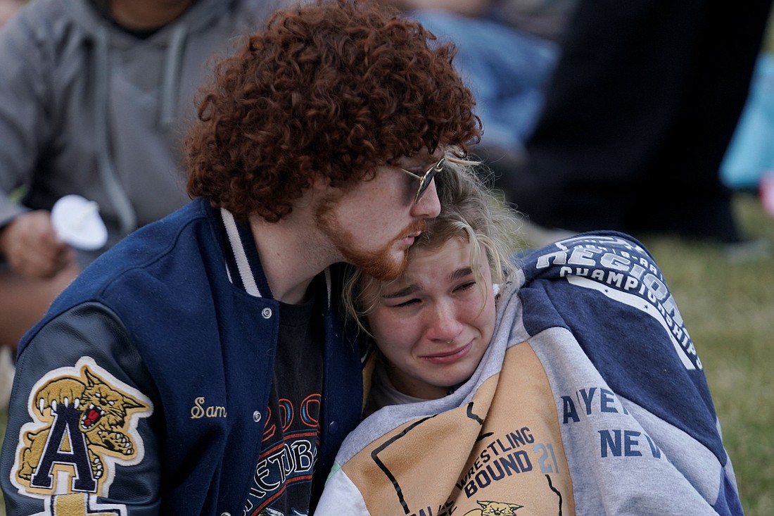 A young woman becomes emotional as she attends a vigil at Jug Tavern Park in Winder, Ga., Sept. 4, 2024, following a shooting that day at Apalachee High School in Winder. A 14-year-old student opened fire at the school killing at least two teachers and two students, authorities said. (OSV News photo/Elijah Nouvelage, Reuters)