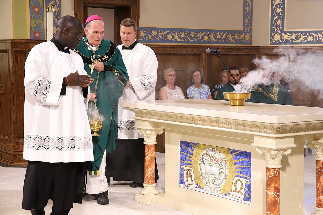 Bishop David M. O'Connell, C.M., incenses the altar in St. Margaret Church, Spring Lake, Aug. 24. In his Gospel reflection for Sept. 8, Father Garry Koch speaks of the imagery that Jesus used to convey messages as well as symbols, signs and gestures, such as incense, that the Church continues to use today. John Batkowski photo