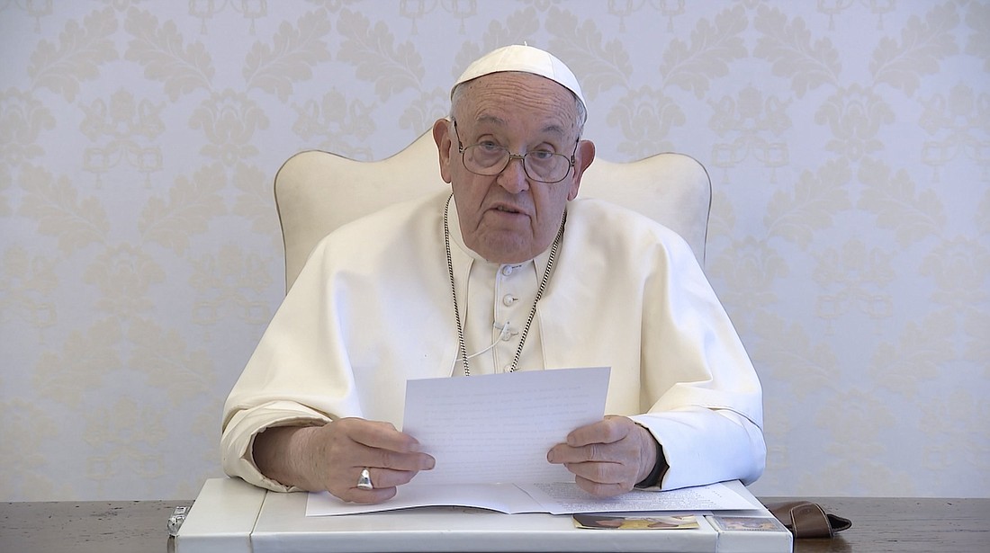 Pope Francis reads a message to participants in the International Eucharistic Congress in Quito, Ecuador, in this screengrab of a video message taken Sept. 9, 2024. (CNS screengrab/courtesy Holy See Press Office)