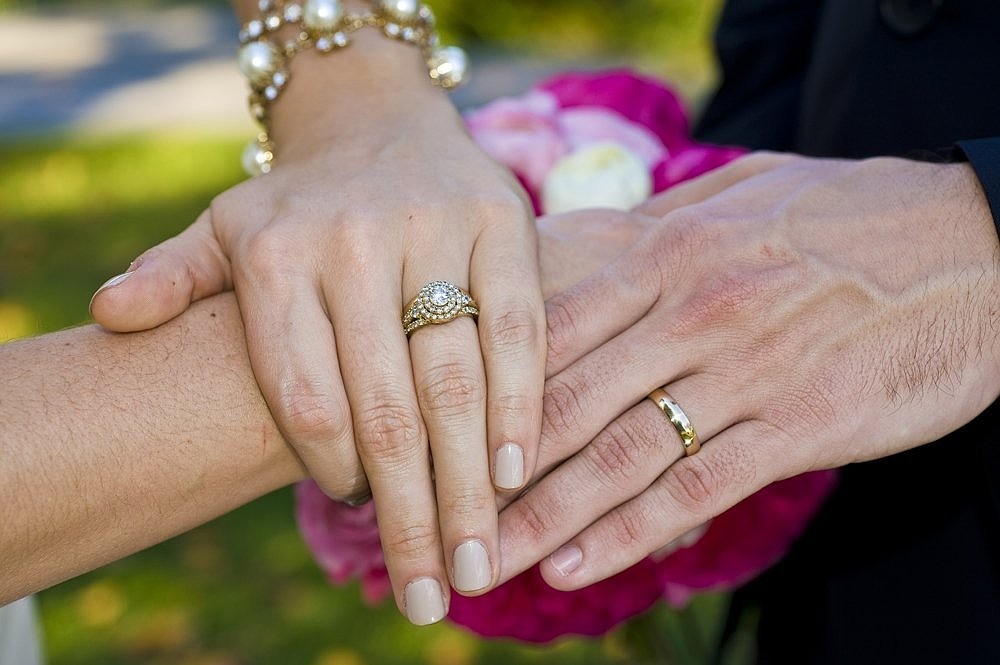 This is an illustration of a couple displaying their wedding rings. (OSV News illustration/CNS file, Sam Lucero)