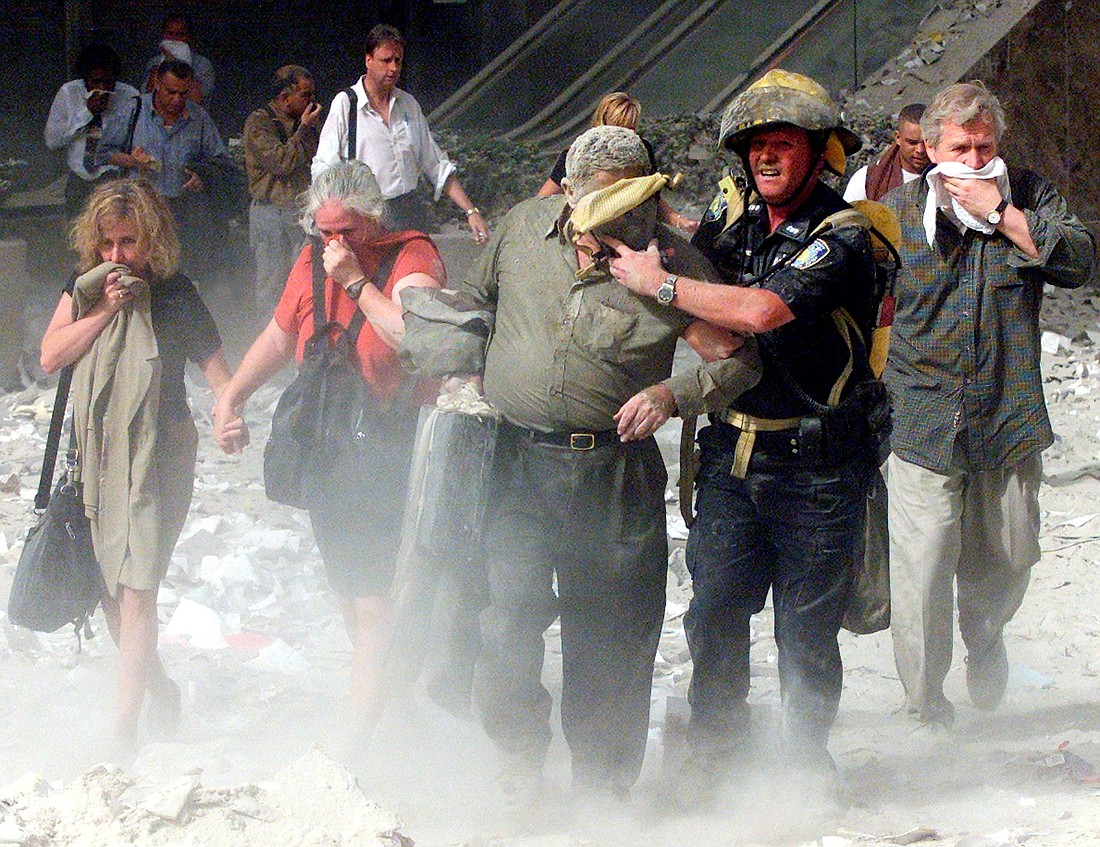 People walk away from the World Trade Center in New York City Sept. 11, 2001. Nearly 3,000 people died in the collapse of New York City’s World Trade Center's twin towers, at the Pentagon and in rural Pennsylvania when terrorists attacked the United States using commercial airplanes on 9/11. (OSV News photo/Shannon Stapleton, Reuters)