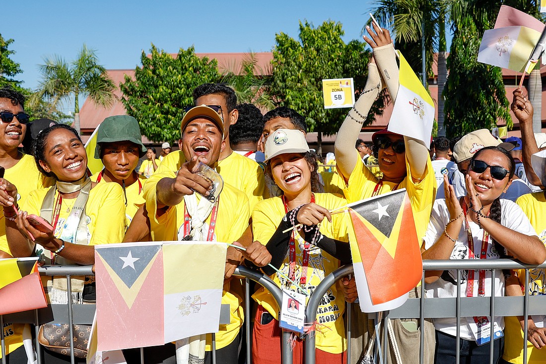 Young people wait for Pope Francis outside a convention center in Dili, Timor-Leste, Sept. 11, 2024. (CNS photo/Lola Gomez)