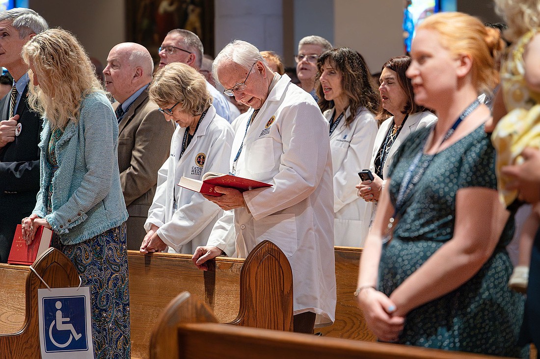 Physicians from across the United States gather for the White Mass at the Basilica of the National Shrine of Mary, Queen of the Universe in Orlando, Fla., Sept. 7, 2024. Bishop John G. Noonan of Orlando celebrated the Mass, which closed the Catholic Medical Association 93rd annual educational conference. (OSV News photo/Andrea Navarro, Florida Catholic)