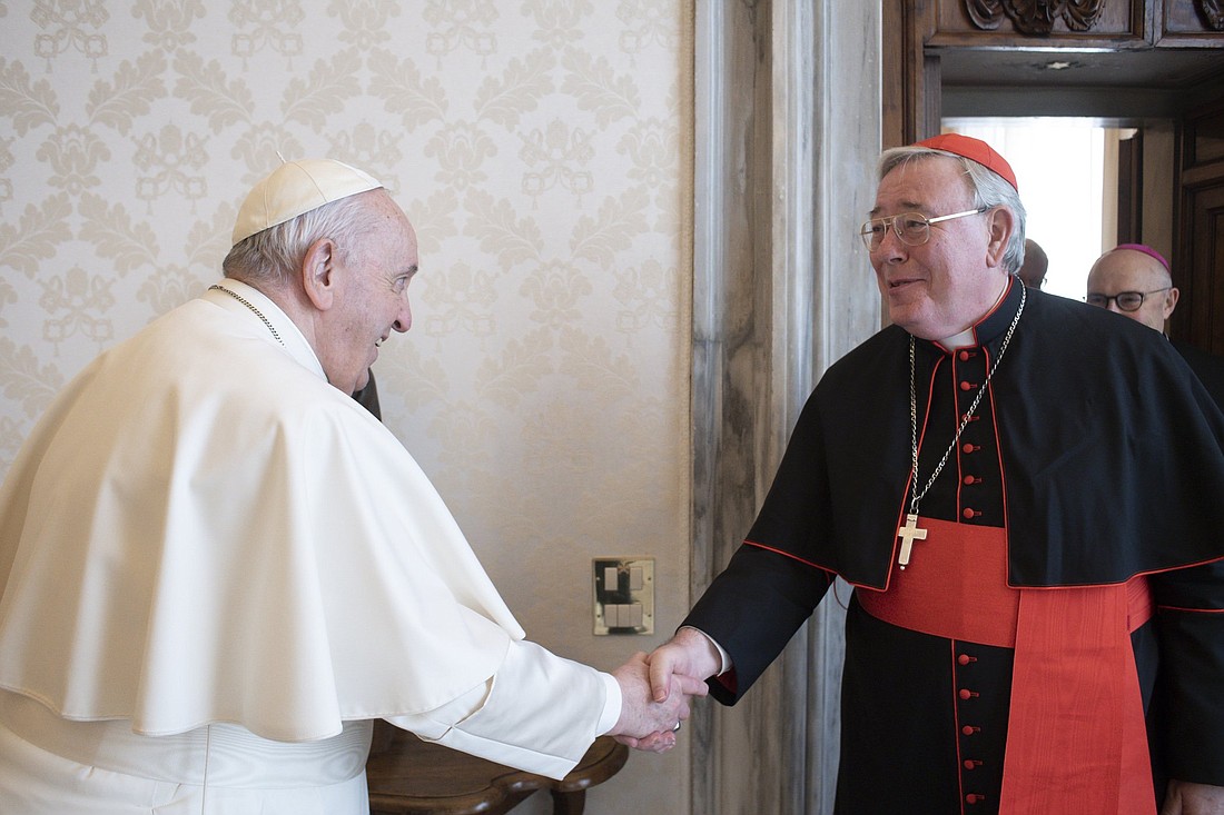 Pope Francis greets Cardinal Jean-Claude Hollerich of Luxembourg during the cardinal's "ad limina" visit to the Vatican Feb. 14, 2022. (CNS photo/Vatican Media)