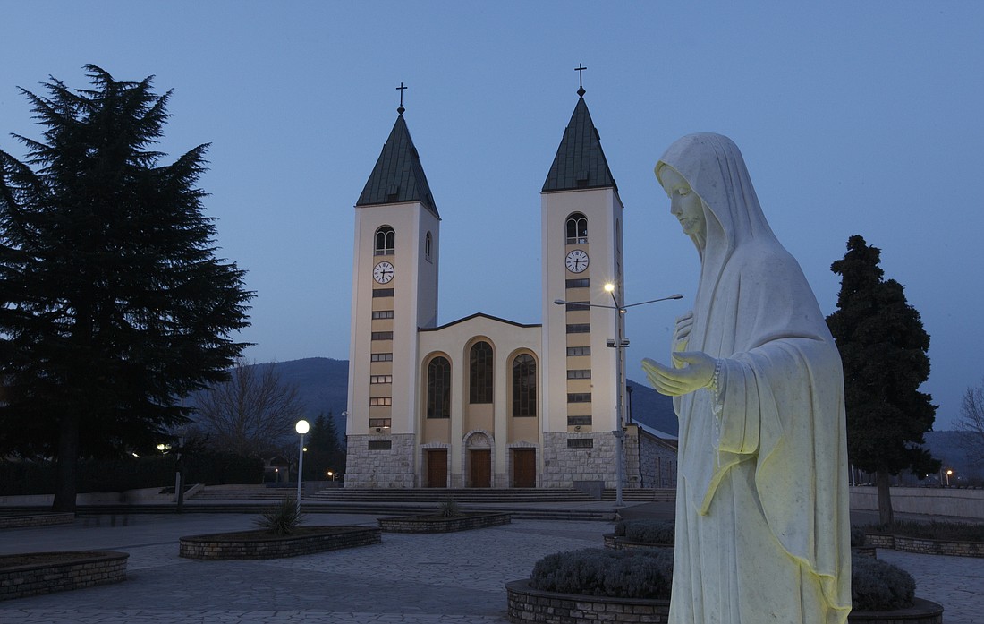 A statue of Mary is seen outside St. James Church in Medjugorje, Bosnia-Herzegovina, in this 2011 file photo. Bosnian church officials are defending the commemoration of thousands of ethnic Croatian civilians and soldiers massacred by communist forces in post-war Yugoslavia, despite international condemnations and domestic protests. (CNS photo/Paul Haring) See BOSNIA-COMMEMORATE-CONTROVERSY June 1, 2020.