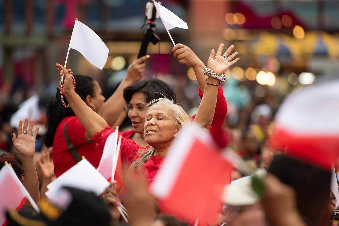 A woman prays during a Eucharistic procession through the Manhattan borough of New York City to St. Patrick's Cathedral for a Pentecost Vigil May 27, 2023. The Charismatic Renewal event in Spanish attracted close to 2,700 people. (OSV News photo/Jeffrey Bruno)