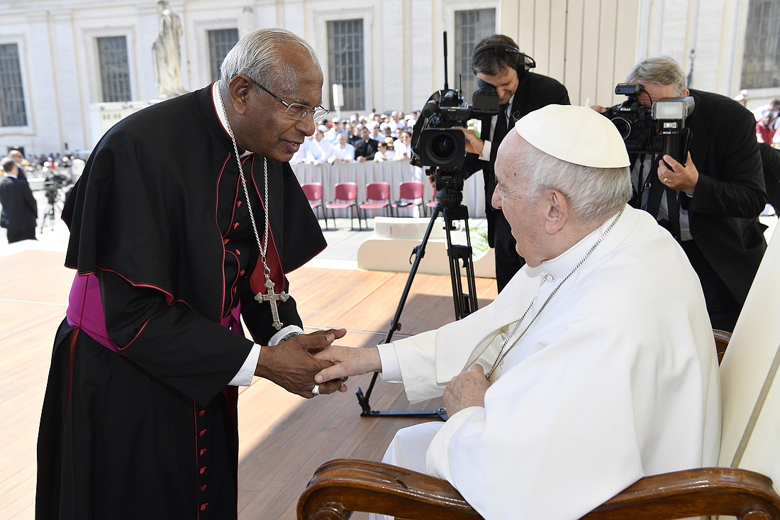 Pope Francis greets Syro-Malabar Archbishop Andrews Thazhath of Trichur, India, at the end of the pope's general audience at the Vatican June 15, 2022. (CNS photo/Vatican Media).