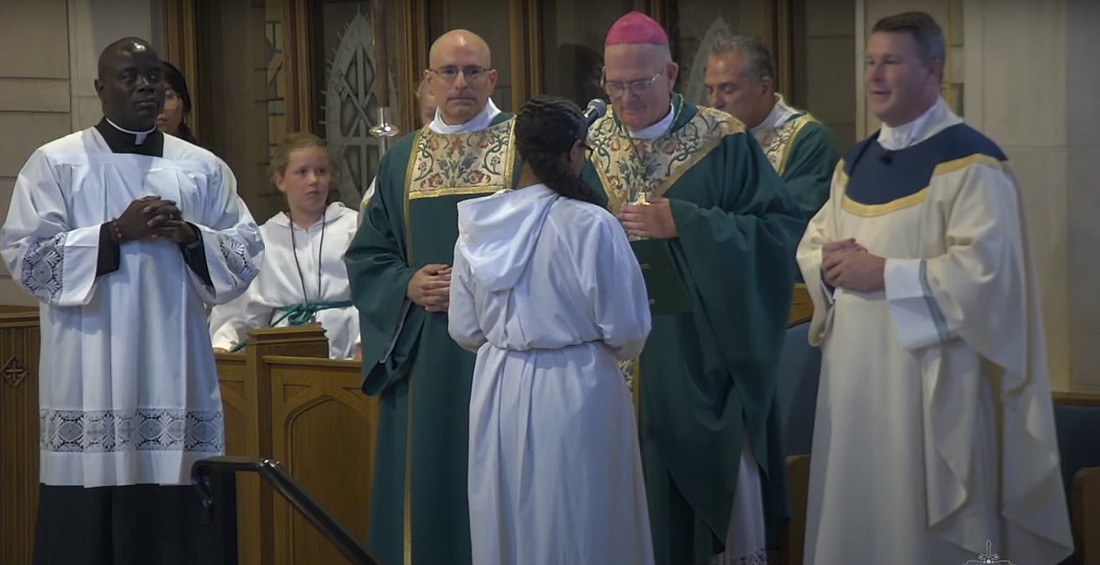 Father Christopher Dayton, right, was installed as pastor of St. Paul Parish, Princeton, during a Sept. 22 Mass celebrated by Bishop David M. O'Connell, C.M.