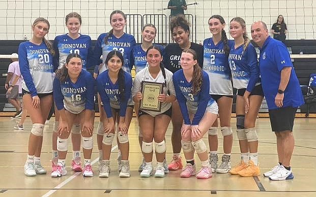 The Donovan Catholic volleyball team displays their plaque for winning the Moorestown Invitational Tournament in early September. Despite heavy graduation losses, the Griffins are off to a 6-1 start with some big tests looming next week. Glenn Jansen photo