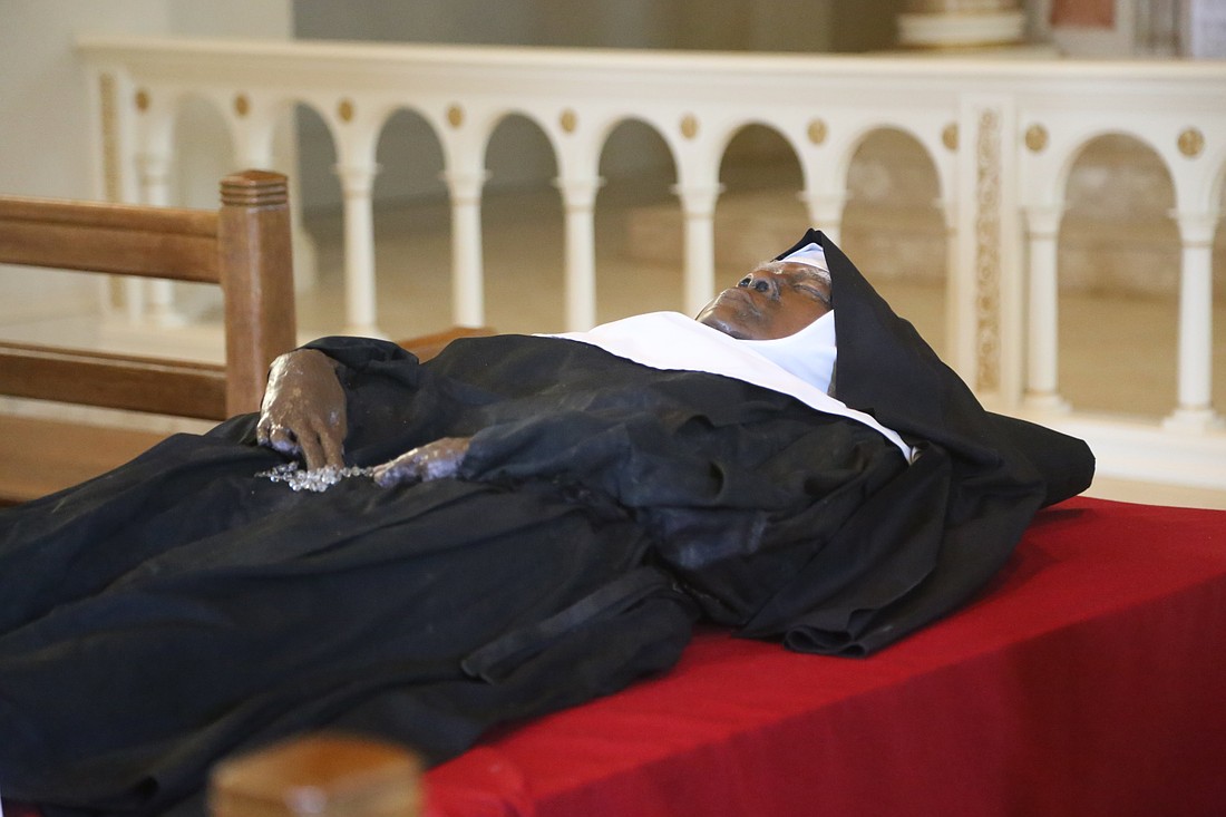 The apparently incorrupt body and religious habit of Sister Wilhelmina Lancaster, foundress of the Benedictines of Mary, Queen of Apostles, lies in repose in the church of the Abbey of Our Lady of Ephesus in Gower, Mo., May 21, 2023. An investigation by the Diocese of Kansas City-St. Joseph, Mo., found her body "does not appear to have experienced the decomposition that would have normally been expected under such previous burial conditions," according to an official diocesan announcement Aug. 22, 2024. (OSV News photo/Megan Marley)