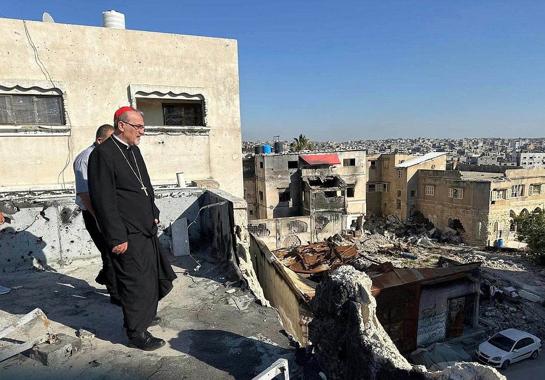 Cardinal Pierbattista Pizzaballa, the Latin patriarch of Jerusalem, walks through the ruins of buildings in Gaza City. He visited northern Gaza Strip May 16-19, 2024, during Pentecost. At a press conference May 20 following his return to Jerusalem, he said he found the small resilient community of the Holy Family Parish compound in Gaza City to have "steadfast faith" amid horrific destruction and constant bombardment. (OSV News photo/courtesy Latin Patriarchate of Jerusalem).