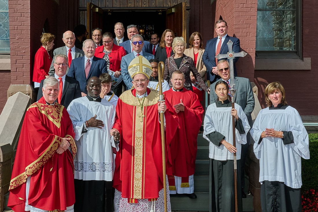 Attorneys, as well as law and civic officials and judges. gather for a group photo with Bishop O'Connell following the Red Mass he celebrated Oct. 6 in St. Michael Church, West End. At far left in first row is Father John Butler, St. Michael pastor. Shown to the Bishop's left is Father Carlos Castilla, parochial vicar. Mike Ehrmann photo