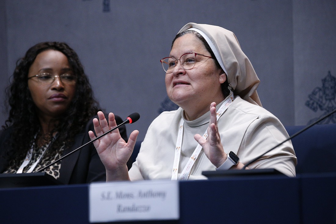 Sister Xiskya Lucia Valladares, a member of the Religious of the Purity of Mary, speaks during a news conference at the Vatican Oct. 4, 2024. To the left is Sheila Leocádia Pires, secretary of the synod's information committee. (CNS photo/Justin McLellan)