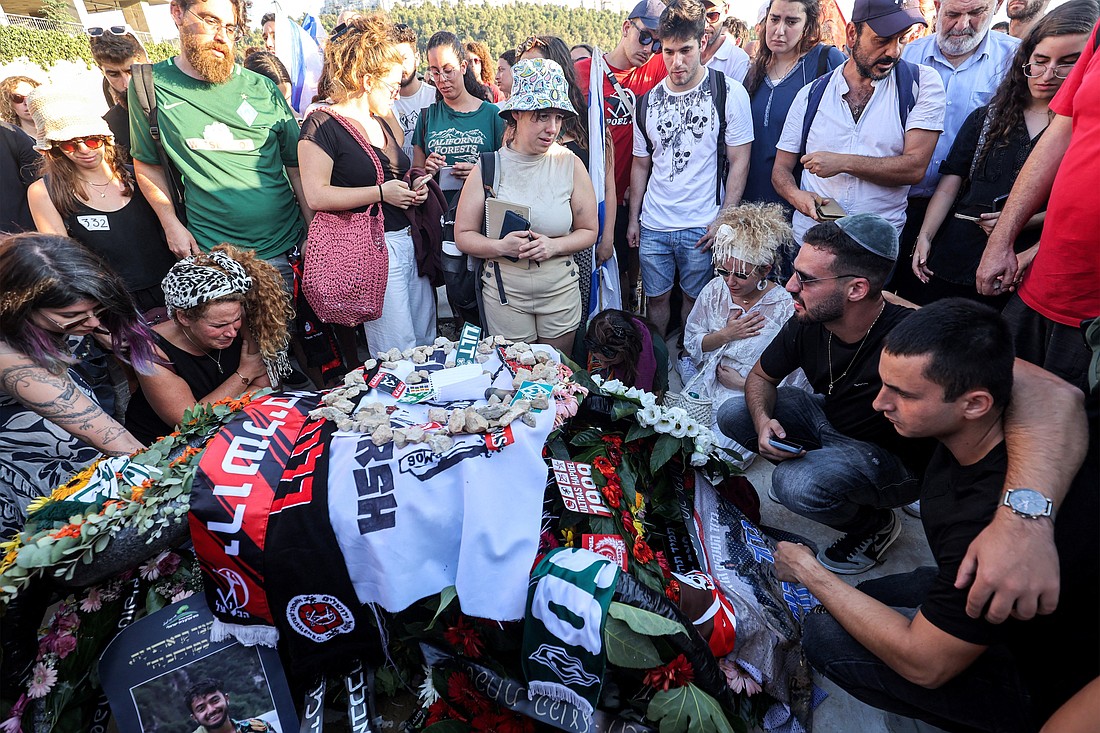 Mourners gather by the grave of killed U.S.-Israeli hostage Hersh Goldberg-Polin whose body was recovered with five other hostages in the Gaza Strip Sept. 1, 2024, during the funeral at Givat Shaul cemetery in Jerusalem Sept. 2, amid the ongoing conflict between Israel and the Palestinian militant group Hamas. The six were among 250 hostages seized during Hamas's Oct. 7 attack that triggered the ongoing war between Israel and Hamas. (OSV News photo/Gil Cohen-Magen pool Via Reuters)