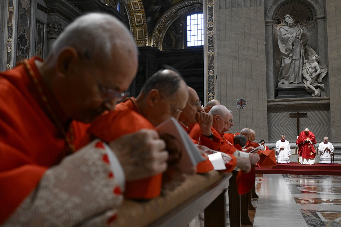 Cardinals kneel in prayer as Pope Francis presides over the Good Friday Liturgy of the Lord's Passion in St. Peter's Basilica at the Vatican March 29, 2024. (CNS photo/Vatican Media)