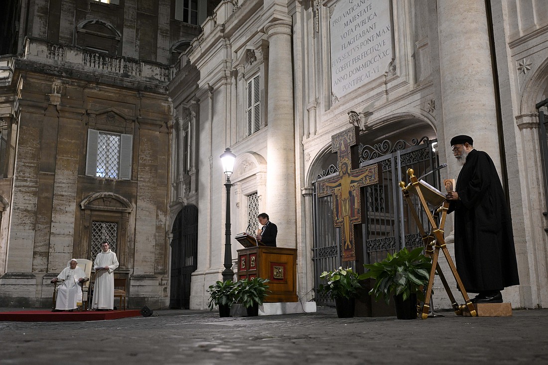 Pope Francis listens as clergy of other churches read prayers during an ecumenical vigil with participants in the Synod of Bishops Oct. 11, 2024, in the Square of the Roman Protomartyrs at the Vatican. The square, just south of St. Peter's Basilica, is the site where St. Peter and other Christians were martyred in the first century under the Emperor Nero. (CNS photo/Vatican Media)