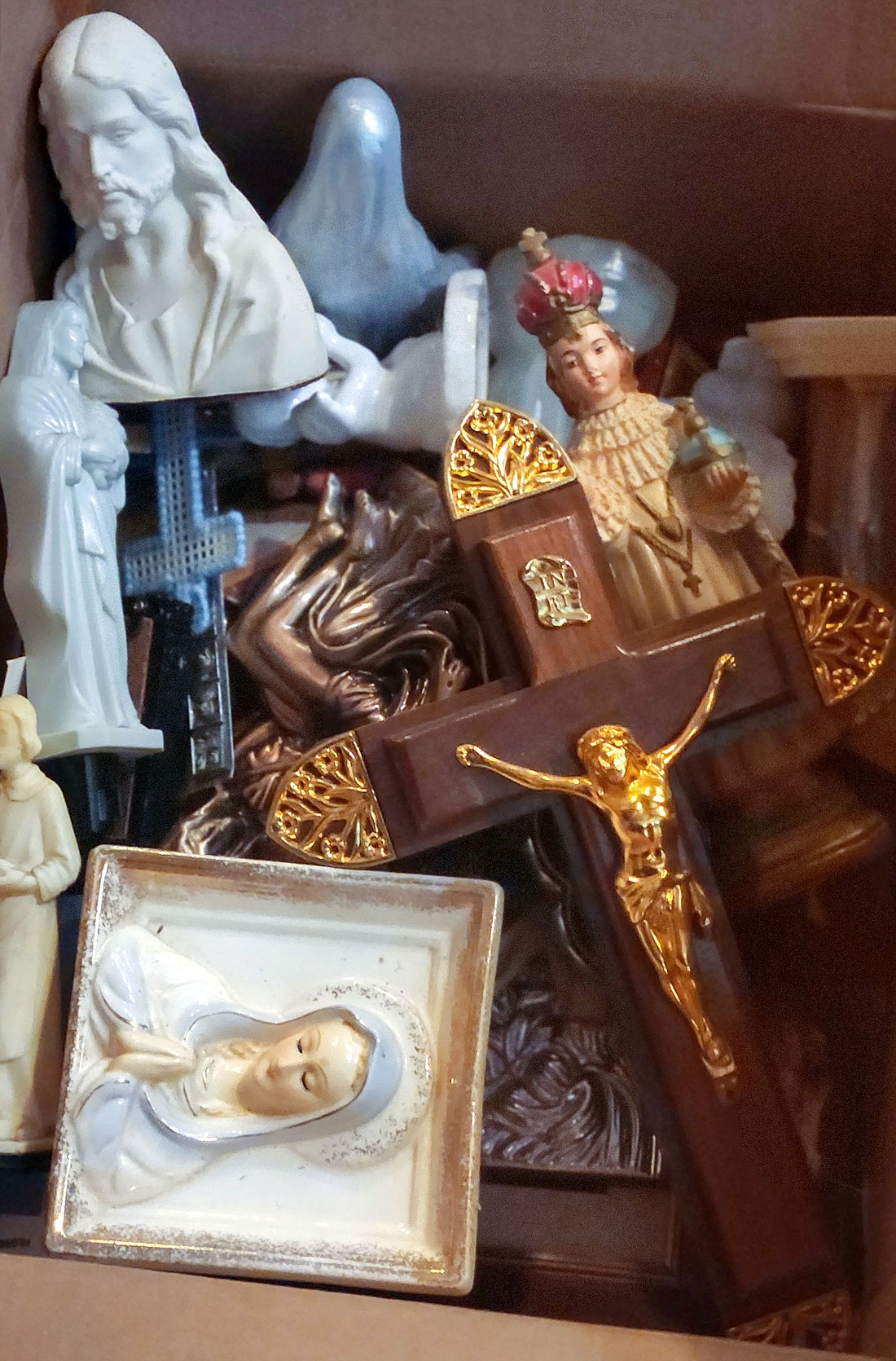 A box of religious items destined for recycling by St. Mary Recycle Mission Group is seen July 27, 2024, at Immaculate Conception Church in Ithaca, NY. Based in Lancaster, Pa., the mission group picks up unwanted items belonging to the parishes and parishioners all over the northeastern United States, repurposing them for use elsewhere. (OSV News photo/Mike Latona, Catholic Courier)