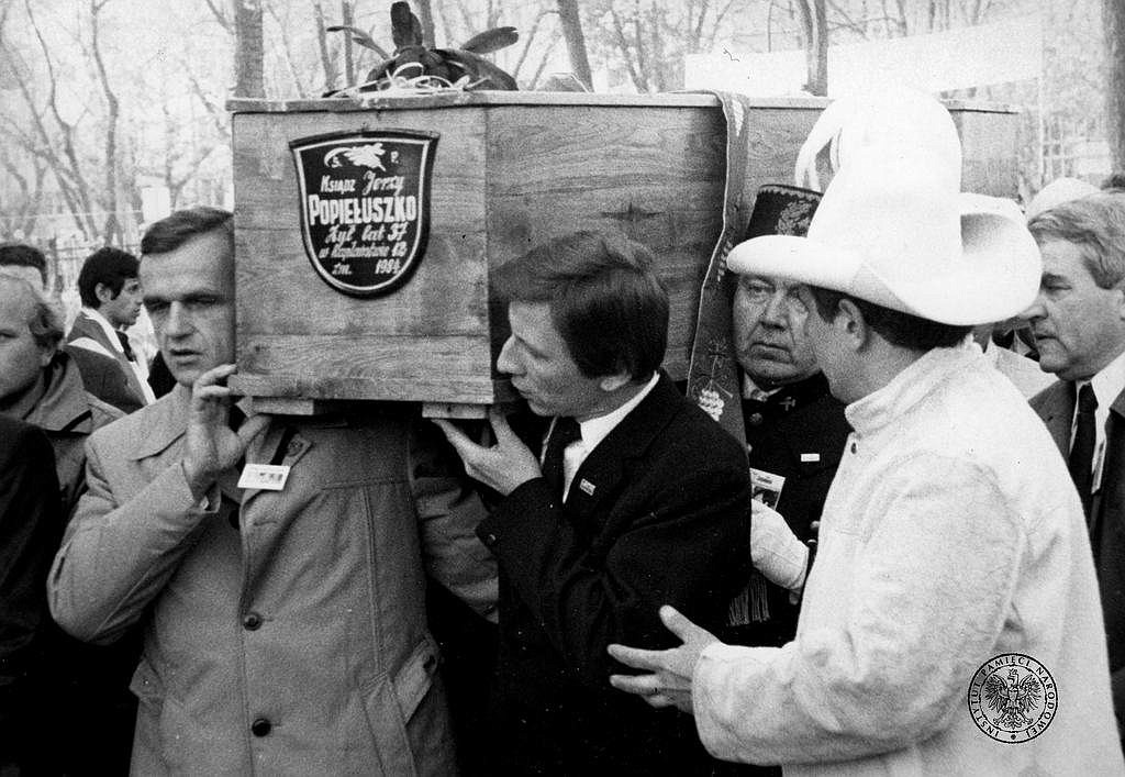 A casket with the body of Father Jerzy Popieluszko, Solidarity's trade union chaplain in communist Poland, is carried during his Nov. 3, 1984, funeral in Warsaw. The priest was murdered by Sluzba Bezpieczenstwa secret service agents Oct. 19, 1984. After being abducted, he was severely beaten, his body tied with ropes and thrown into the Vistula River. On Oct. 30, 1984, his body was dredged from a Vistula River reservoir. Pope Benedict XVI recognized Father Popieluszko's martyrdom Dec. 19, 2009, and he was beatified in 2010. (OSV News photo/courtesy Institute of National Remembrance IPN)