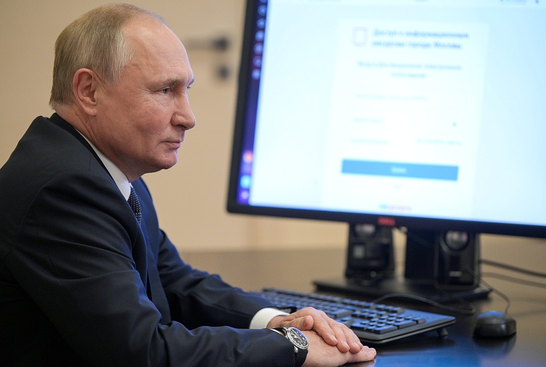 Russian President Vladimir Putin is pictured in a file photo sitting in front of a computer at his residence outside Moscow. Human rights monitor Forum 18 reports that Russia continues to block a wide range of religious websites in Russia and in occupied areas of Ukraine, including Katolik.Life from Belarus and the Religious Information Service of Ukraine, founded at Ukrainian Catholic University in Lviv. (OSV News photo/Sputnik/Alexei Druzhinin, Kremlin via Reuters)