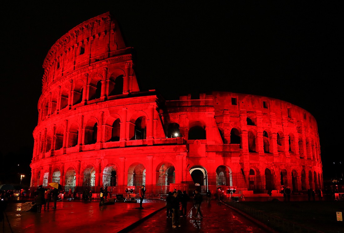 In this photo from Feb. 24, 2018, the Colosseum in Rome is lit up in red to draw attention to the persecution of Christians around the world. The color represents the blood of Christian martyrs. Every November the pontifical foundation Aid to the Church in Need promotes Red Week to draw attention to the persecution of Christians and religious freedom violations around the world. Red Wednesday is observed Nov. 20 in 2024. (OSV News photo/Remo Casilli, Reuters)