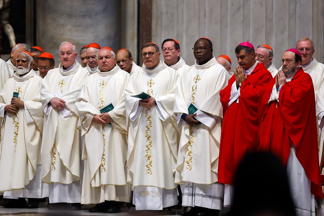 Cardinals pray during Mass presided by Cardinal Mario Grech, secretary-general of the Synod, at the Altar of the Chair in St. Peter’s Basilica at the Vatican Oct. 21, 2024. (CNS photo/Lola Gomez)