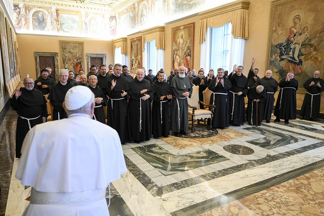 Pope Francis greets the community of priests responsible for hearing confessions in St. Peter's Basilica during an audience at the Vatican Oct. 24, 2024. (CNS photo/Vatican Media)