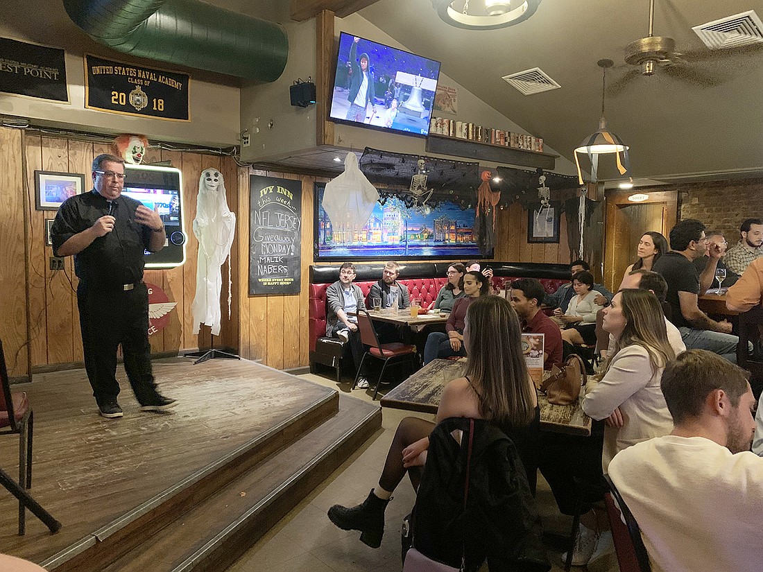 Father Christopher Colavito, diocesan vocations director and chaplain for The College of New Jersey and Notre Dame High School, speaks to young adults in Princeton's Ivy Inn Oct. 23 about the challenges of being a Catholic voter. EmmaLee Italia photo