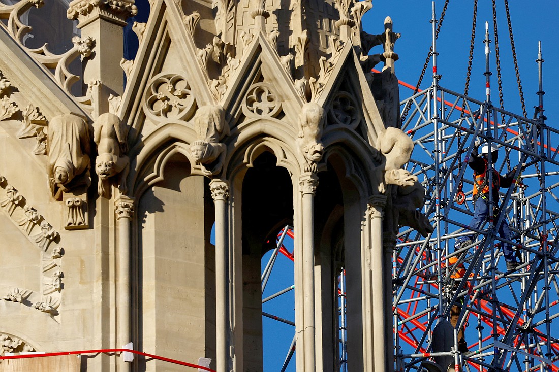 Construction workers dismantle scaffolding on the Notre Dame Cathedral in Paris Oct. 23, 2024, which was ravaged by a fire in 2019, as restoration work continued before its reopening. The iconic cathedral is scheduled to reopen Dec. 8, to be followed by six months of celebrations, Masses, pilgrimages, prayers and exhibitions. (OSV News photo/Stephanie Lecocq, Reuters)