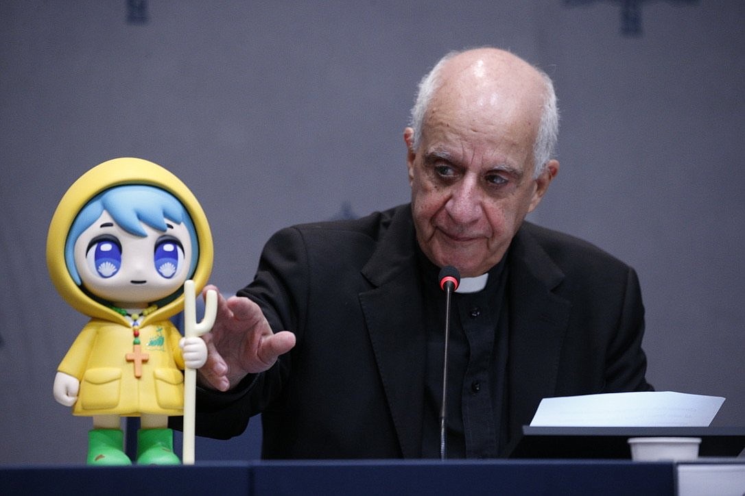 Archbishop Rino Fisichella, pro-prefect of the Dicastery for Evangelization's section for new evangelization and the chief organizer of the Holy Year 2025, presents the official mascot of the Jubilee Year during a news conference at the Vatican Oct. 28, 2024. (CNS photo/Justin McLellan)